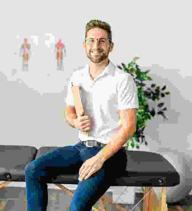 Physiotherapist assessing a patient at PhysiPro